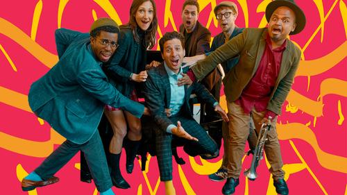 Musicians from the Congregation are huddled together and make an expressive gesture for this group publicity shot, which has a colorful background evocative of jazz